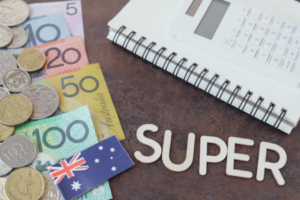 Australian currency next to a book and calculator with the word "Super" in white on brown background - ComSuper Pension Benefits - Call Veterans Health Centre today