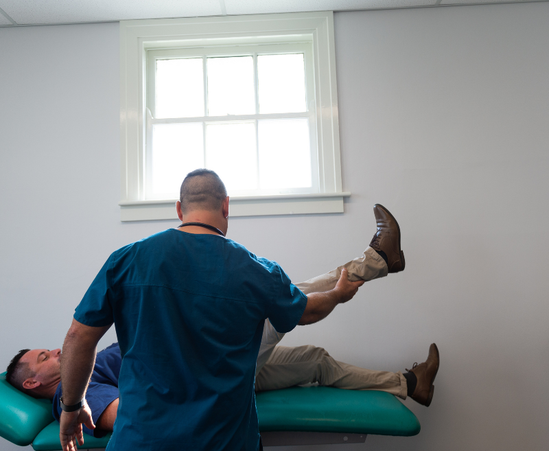 VHC specialist lifting a patient's foot